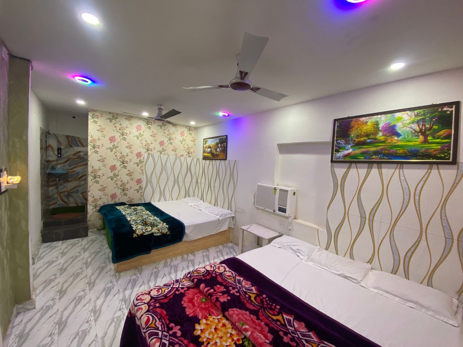 Family Deluxe AC room with two double beds at Hotel Satsangi near Satsang Ashram in Deoghar Jharkhand